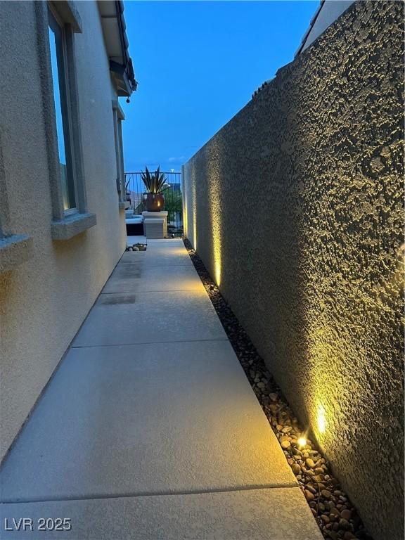 12844 New Providence St, Las Vegas, NV 89141 - view of home's exterior with stucco siding and a balcony