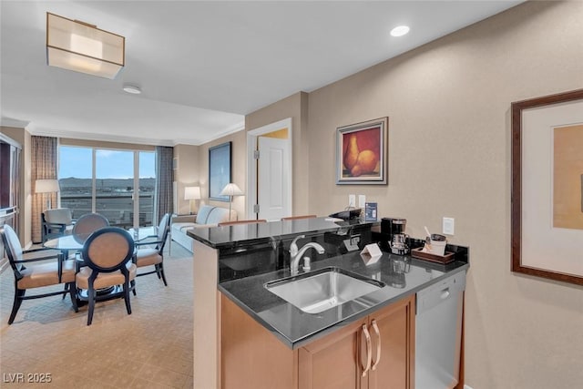 135 E Harmon Ave Unit 1102, Las Vegas, NV 89109 - kitchen with a sink, dishwasher, open floor plan, dark stone counters, and a peninsula