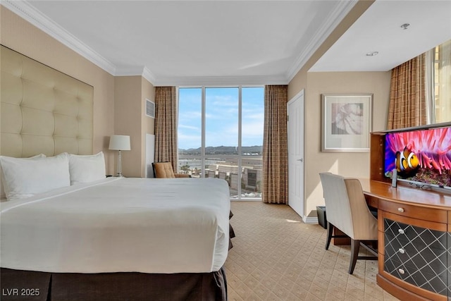 135 E Harmon Ave Unit 1102, Las Vegas, NV 89109 - carpeted bedroom featuring a wall of windows, ornamental molding, access to exterior, and baseboards