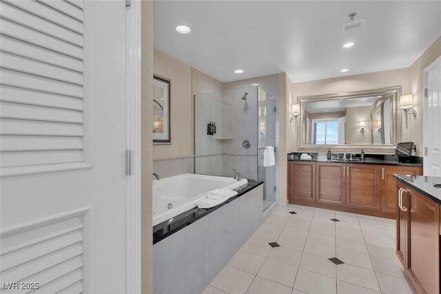 135 E Harmon Ave Unit 1102, Las Vegas, NV 89109 - bathroom with a shower stall, tile patterned flooring, vanity, a tub with jets, and recessed lighting