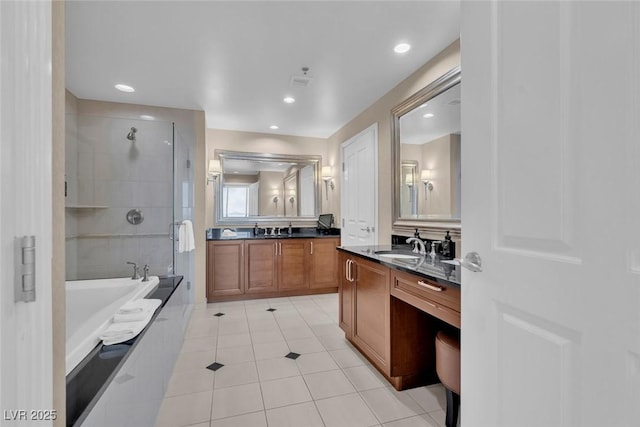 135 E Harmon Ave Unit 1102, Las Vegas, NV 89109 - full bath featuring tile patterned floors, a stall shower, a bath, two vanities, and recessed lighting