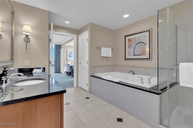 135 E Harmon Ave Unit 1102, Las Vegas, NV 89109 - full bathroom with tile patterned flooring, a stall shower, a bath, vanity, and recessed lighting
