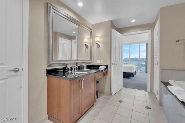 135 E Harmon Ave Unit 1102, Las Vegas, NV 89109 - ensuite bathroom with tile patterned flooring, vanity, baseboards, and recessed lighting