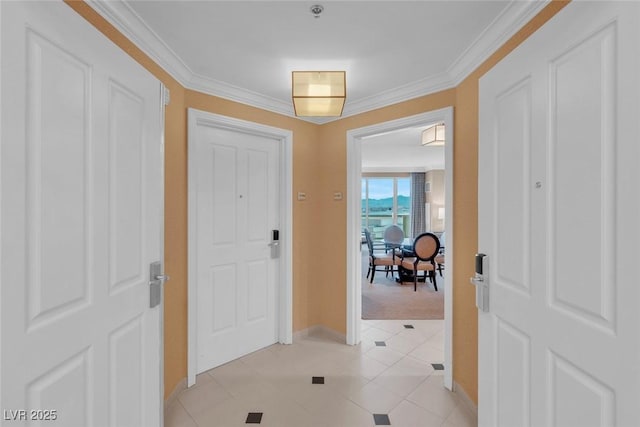 135 E Harmon Ave Unit 1102, Las Vegas, NV 89109 - foyer entrance featuring baseboards, crown molding, light tile patterned flooring, and light carpet