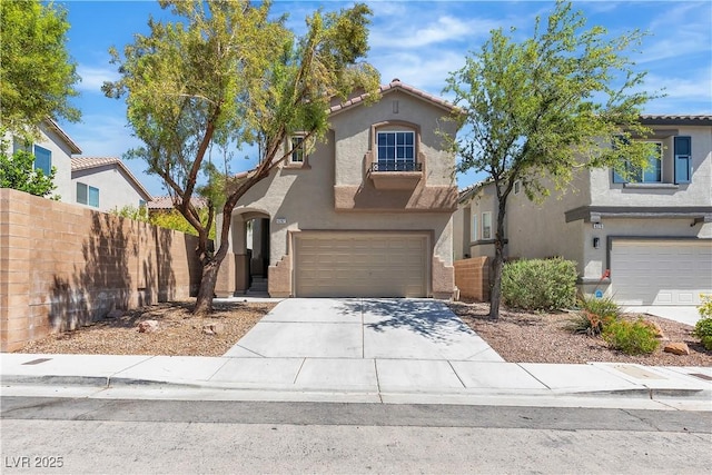 view of front of home featuring stucco siding, fence, an attached garage, and concrete driveway