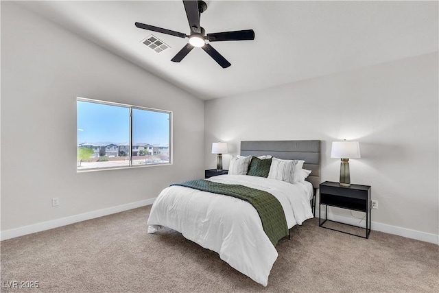 carpeted bedroom featuring lofted ceiling, baseboards, and ceiling fan