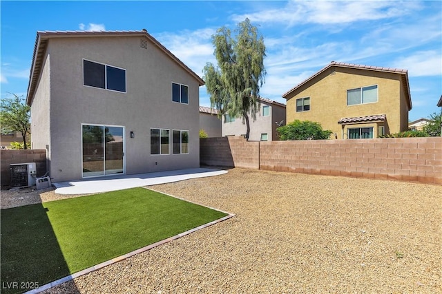 back of property featuring stucco siding, a patio area, and central AC unit