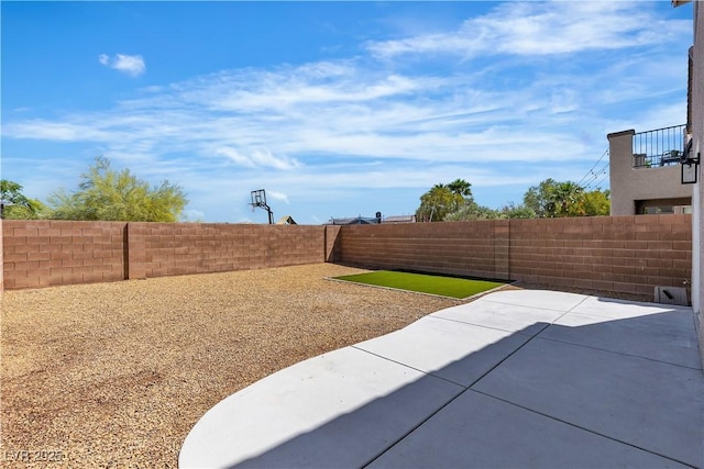 fenced backyard featuring a patio