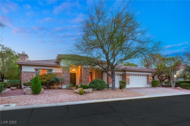 4649 Bird View Ct, Las Vegas, NV 89129 - view of front of house featuring an attached garage, driveway, brick siding, and a chimney
