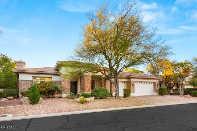 4649 Bird View Ct, Las Vegas, NV 89129 - view of front of house featuring an attached garage, driveway, brick siding, and a chimney