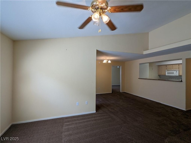 555 E Silverado Ranch Blvd Unit 2147, Las Vegas, NV 89183 - unfurnished room featuring dark colored carpet, ceiling fan, baseboards, and vaulted ceiling