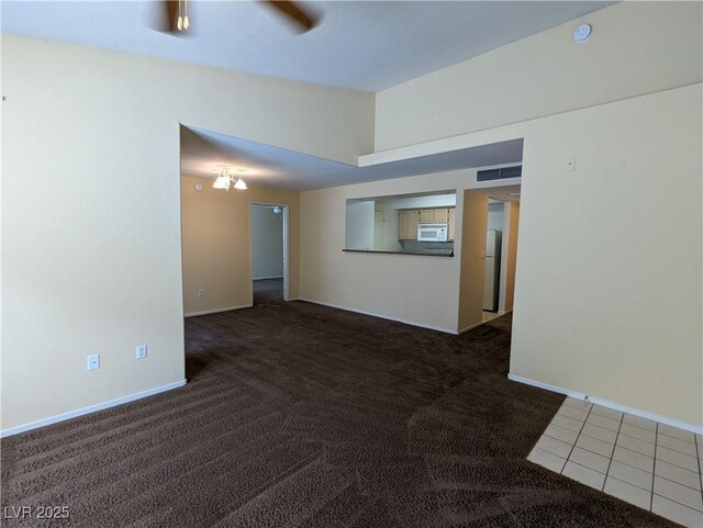 555 E Silverado Ranch Blvd Unit 2147, Las Vegas, NV 89183 - carpeted empty room with baseboards, tile patterned floors, and a smoke detector