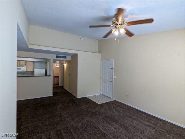 555 E Silverado Ranch Blvd Unit 2147, Las Vegas, NV 89183 - spare room with dark colored carpet, a ceiling fan, and baseboards