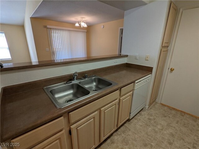 555 E Silverado Ranch Blvd Unit 2147, Las Vegas, NV 89183 - kitchen with white dishwasher, a sink, a chandelier, and dark countertops