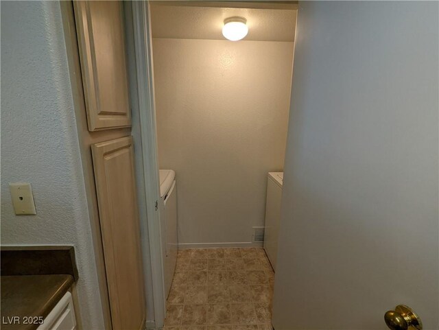 555 E Silverado Ranch Blvd Unit 2147, Las Vegas, NV 89183 - bathroom with separate washer and dryer, toilet, and tile patterned floors
