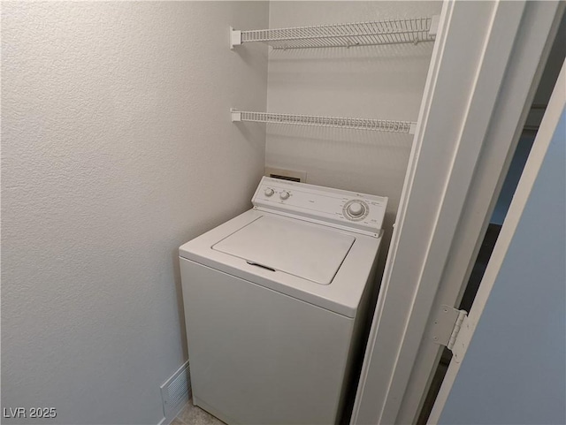 555 E Silverado Ranch Blvd Unit 2147, Las Vegas, NV 89183 - laundry area with washer / clothes dryer and a textured wall
