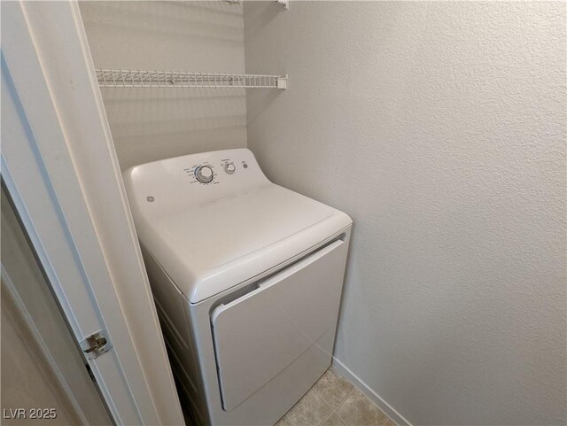 555 E Silverado Ranch Blvd Unit 2147, Las Vegas, NV 89183 - washroom with washer / dryer and light tile patterned floors