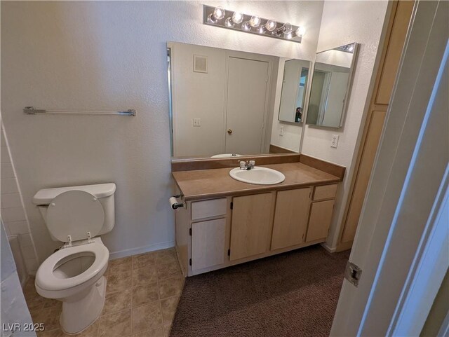 555 E Silverado Ranch Blvd Unit 2147, Las Vegas, NV 89183 - bathroom with toilet, vanity, baseboards, and tile patterned flooring