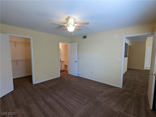 555 E Silverado Ranch Blvd Unit 2147, Las Vegas, NV 89183 - unfurnished bedroom featuring carpet floors, a walk in closet, baseboards, and a closet