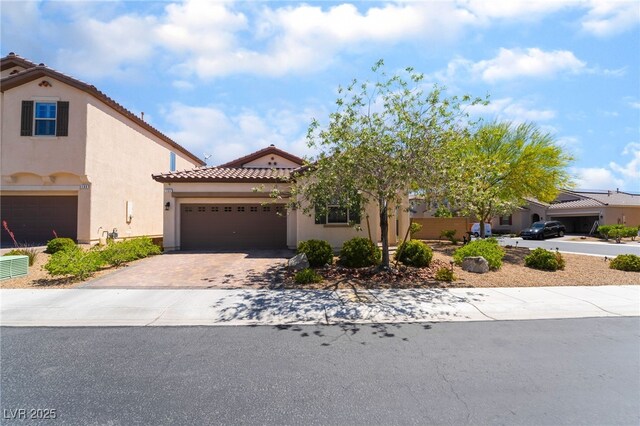 184 Cullerton St, Las Vegas, NV 89148 - mediterranean / spanish-style house with stucco siding, driveway, a tiled roof, and a garage