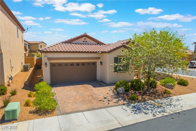 184 Cullerton St, Las Vegas, NV 89148 - mediterranean / spanish home with stucco siding, a tiled roof, a garage, and decorative driveway