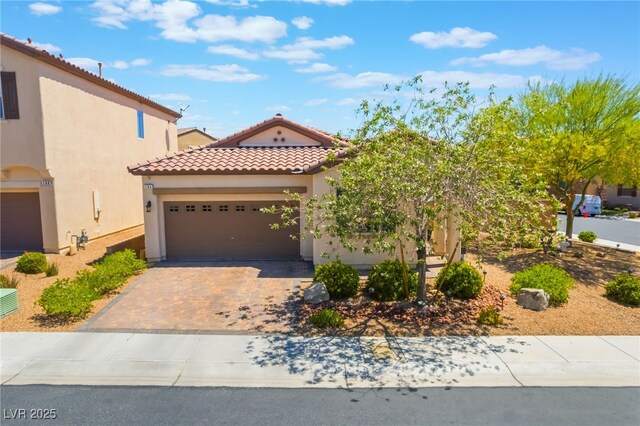 184 Cullerton St, Las Vegas, NV 89148 - mediterranean / spanish house with driveway, stucco siding, an attached garage, and a tiled roof