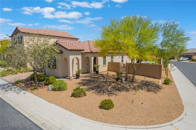 184 Cullerton St, Las Vegas, NV 89148 - mediterranean / spanish-style home featuring a tile roof, stucco siding, and fence