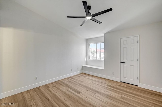 2725 S Nellis Blvd Unit 2036, Las Vegas, NV 89121 - spare room with light wood-style flooring, a ceiling fan, baseboards, and vaulted ceiling