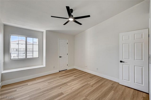 2725 S Nellis Blvd Unit 2036, Las Vegas, NV 89121 - spare room with light wood-style flooring, a ceiling fan, baseboards, and vaulted ceiling