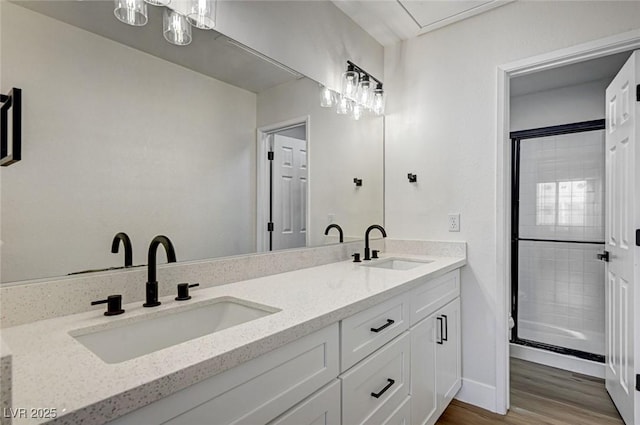 2725 S Nellis Blvd Unit 2036, Las Vegas, NV 89121 - full bath with double vanity, wood finished floors, a shower stall, and baseboards