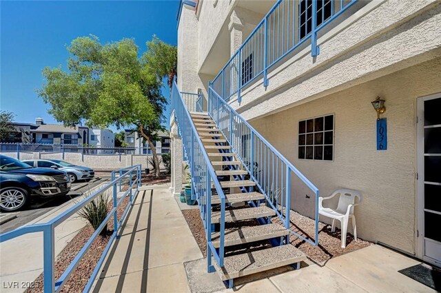 2725 S Nellis Blvd Unit 2036, Las Vegas, NV 89121 - view of patio / terrace with stairway, fence, and a residential view