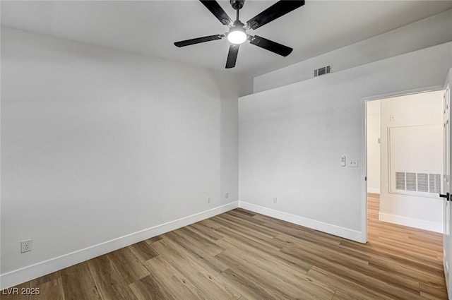 2725 S Nellis Blvd Unit 2036, Las Vegas, NV 89121 - empty room with wood finished floors, baseboards, and a ceiling fan