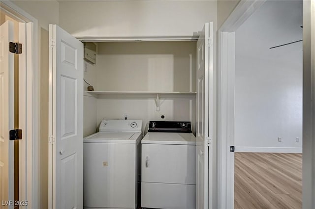 2725 S Nellis Blvd Unit 2036, Las Vegas, NV 89121 - laundry area featuring washer and dryer, light wood-style flooring, and baseboards