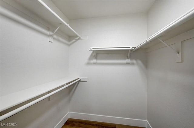 2725 S Nellis Blvd Unit 2036, Las Vegas, NV 89121 - spacious closet featuring dark wood-style floors