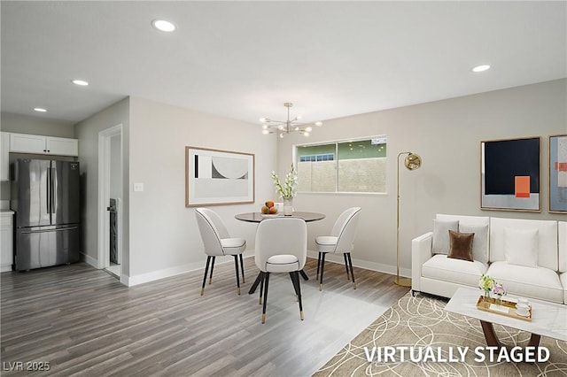 dining space with wood finished floors, a chandelier, baseboards, and recessed lighting
