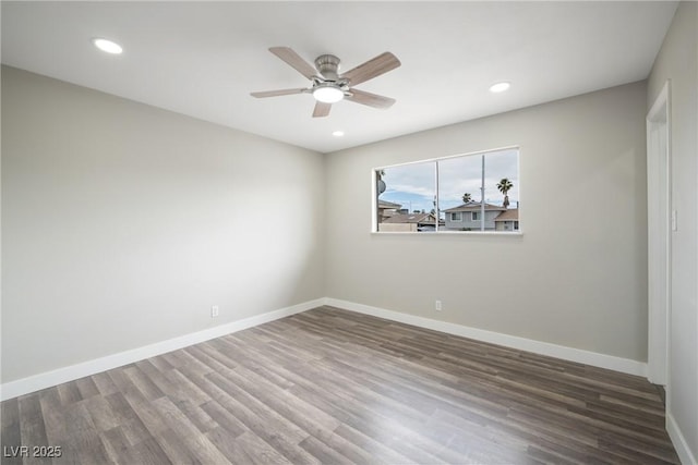 unfurnished room with ceiling fan, wood finished floors, recessed lighting, and baseboards