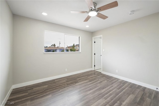 spare room featuring wood finished floors, baseboards, ceiling fan, recessed lighting, and a smoke detector