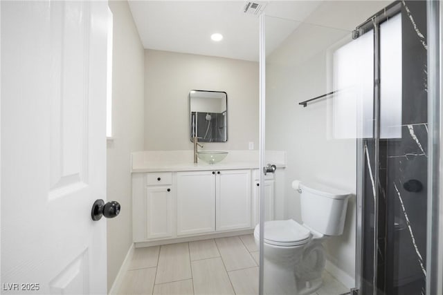 full bathroom featuring baseboards, toilet, vanity, and an enclosed shower