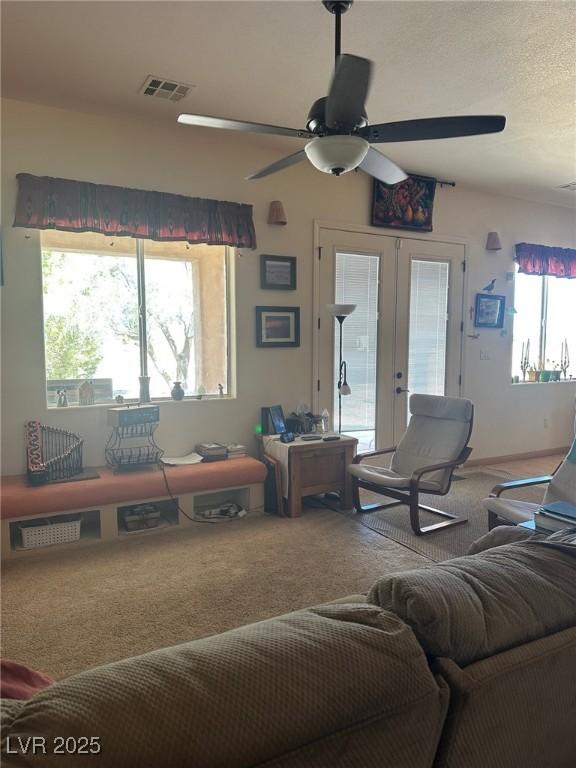 3551 Sagebrush Ave, Pahrump, NV 89048 - carpeted living room featuring a ceiling fan and french doors