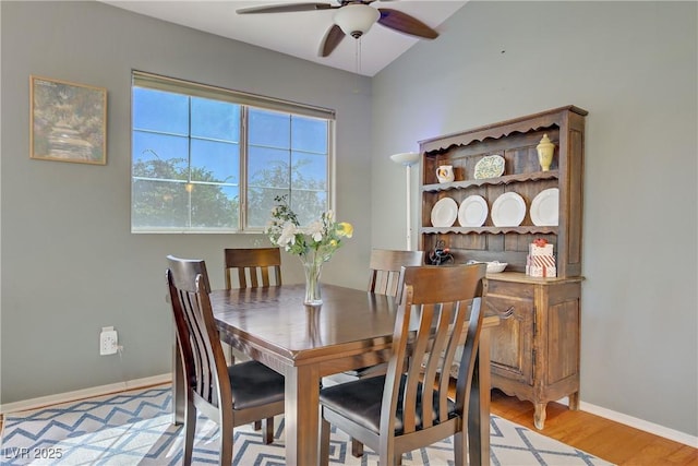 2325 Windmill Pkwy Unit 321, Henderson, NV 89074 - dining area with a ceiling fan, wood finished floors, and baseboards