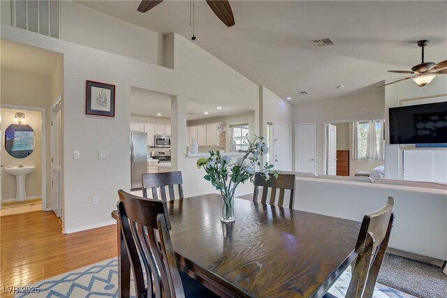 2325 Windmill Pkwy Unit 321, Henderson, NV 89074 - dining space with ceiling fan, healthy amount of natural light, light wood-style flooring, high vaulted ceiling, and recessed lighting