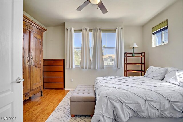 2325 Windmill Pkwy Unit 321, Henderson, NV 89074 - bedroom featuring wood finished floors, ceiling fan, and baseboards