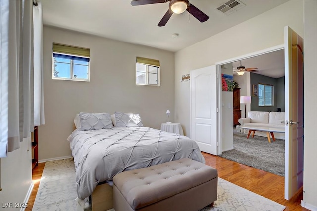 2325 Windmill Pkwy Unit 321, Henderson, NV 89074 - bedroom featuring light wood-style floors, ceiling fan, and baseboards