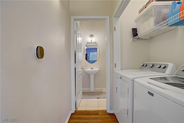 2325 Windmill Pkwy Unit 321, Henderson, NV 89074 - laundry room featuring independent washer and dryer and tile patterned floors