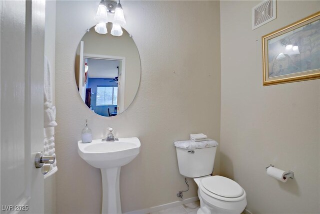 2325 Windmill Pkwy Unit 321, Henderson, NV 89074 - half bathroom with toilet and baseboards