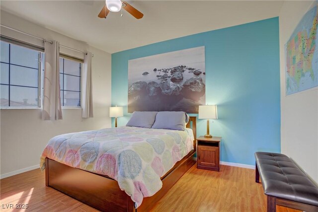 2325 Windmill Pkwy Unit 321, Henderson, NV 89074 - bedroom featuring light wood-style floors, baseboards, and ceiling fan