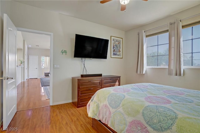 2325 Windmill Pkwy Unit 321, Henderson, NV 89074 - bedroom featuring wood finished floors, baseboards, and ceiling fan