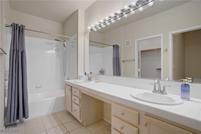 2325 Windmill Pkwy Unit 321, Henderson, NV 89074 - bathroom with double vanity, shower / bath combo, tile patterned flooring, and a walk in closet
