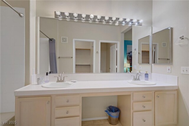2325 Windmill Pkwy Unit 321, Henderson, NV 89074 - bathroom featuring double vanity and a shower