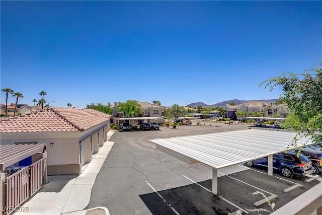 2325 Windmill Pkwy Unit 321, Henderson, NV 89074 - uncovered parking lot with a residential view and a mountain view